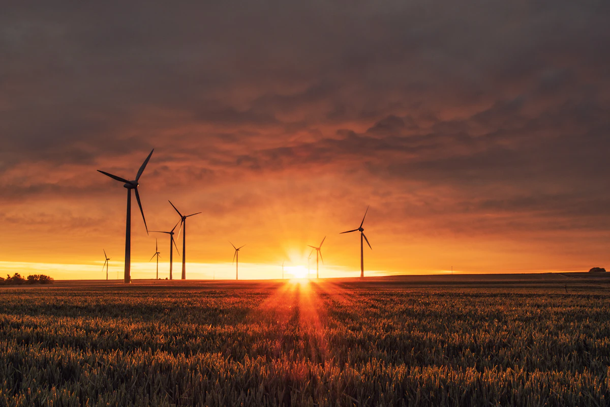Wind turbines on green hills, clean energy for sustainable building