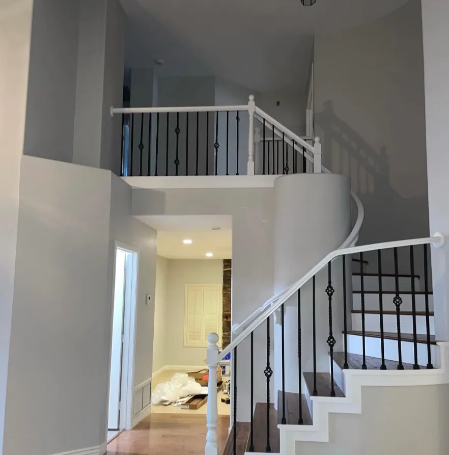 Whole-home renovation, open staircase with iron rail