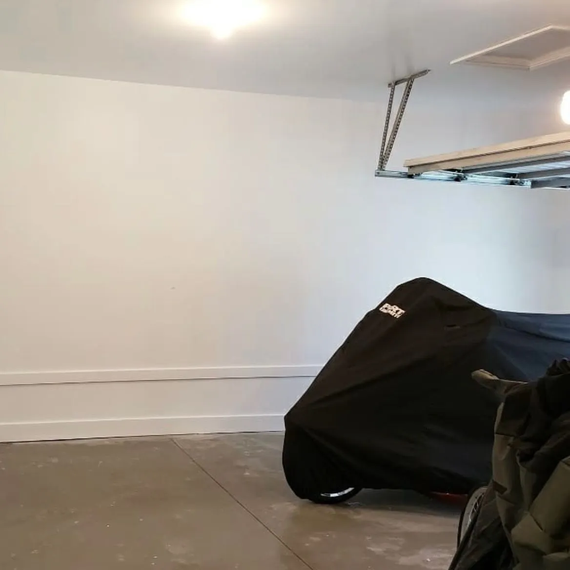 A garage interior with finished walls, prepared for conversion in Ontario