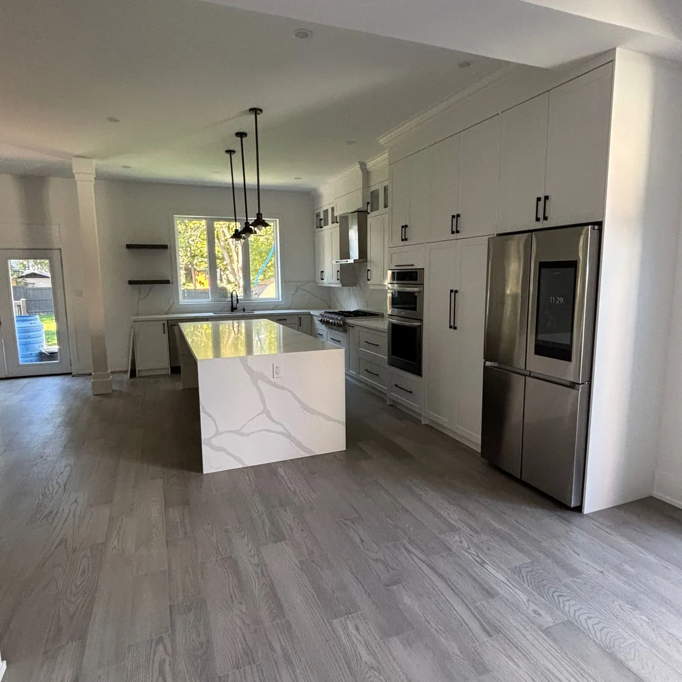 A modern condo kitchen renovation by Zeybek Construction in Ontario