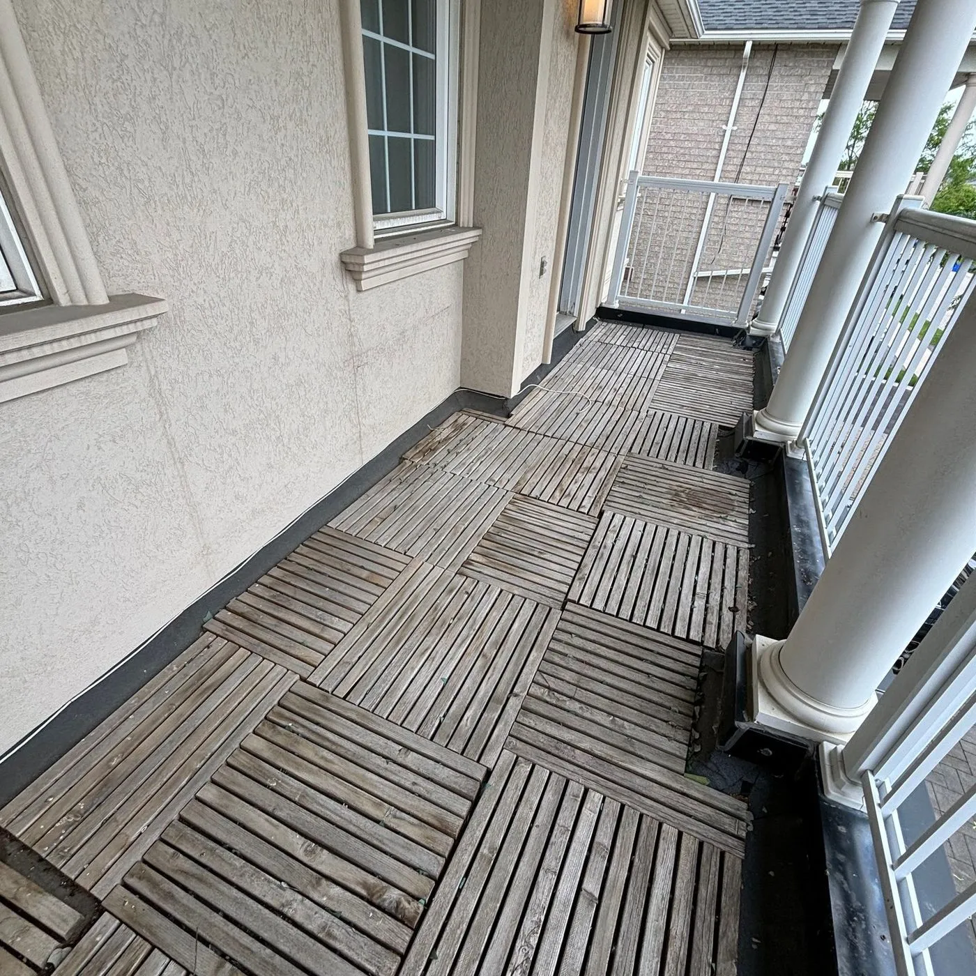 A finished backyard deck and outdoor living space by Zeybek Construction in Ontario