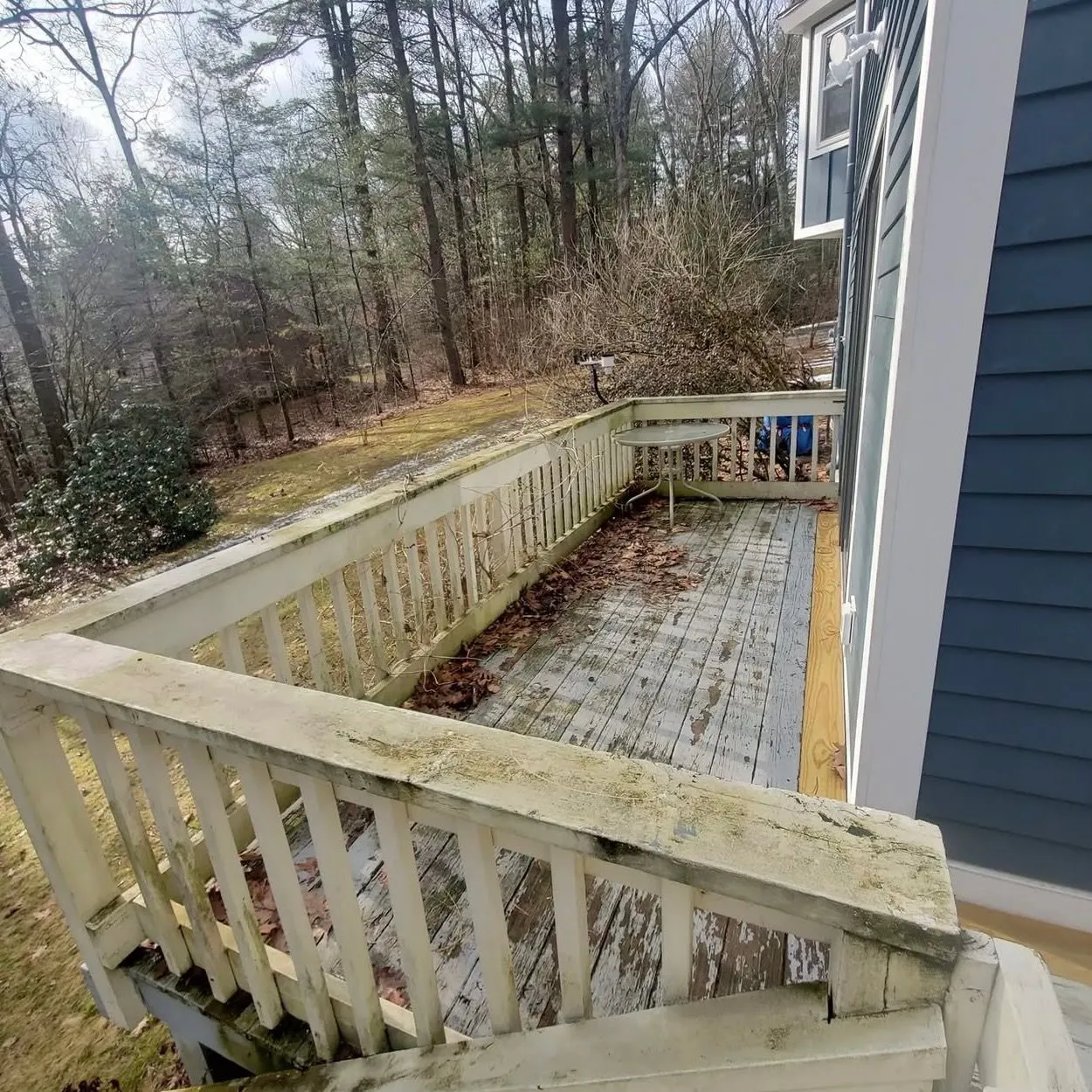 A retaining wall and regraded slope beside an Ontario home by Zeybek Construction